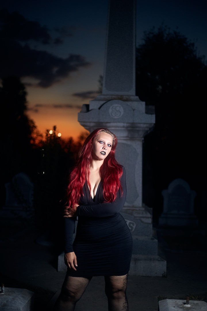 Starrgazzee standing in front of a monument at sunset