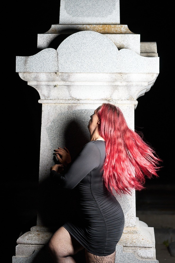 Starrgazzee looking back beside a white stone monument