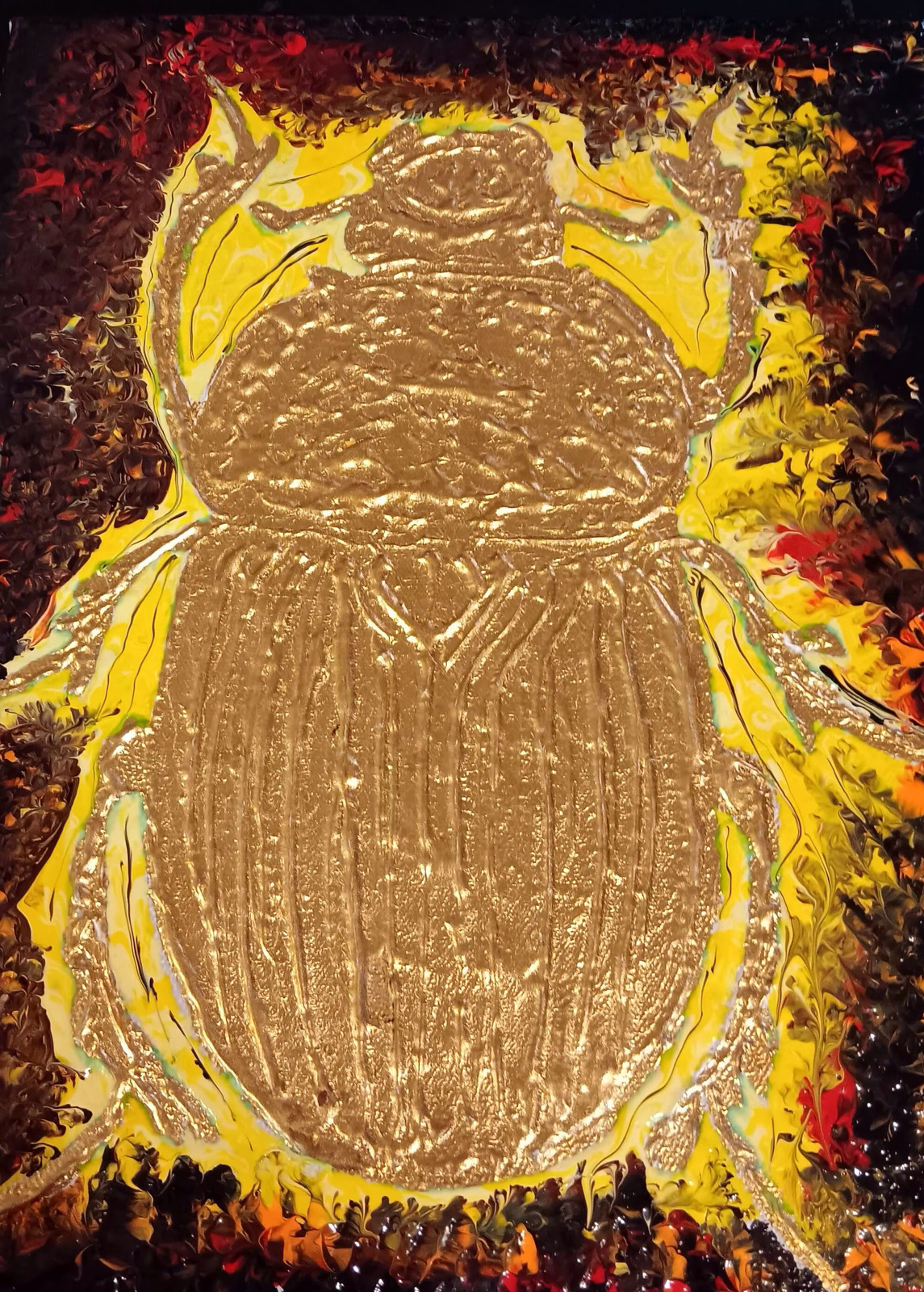 A metallic gold beetle on a yellow, red and black background
