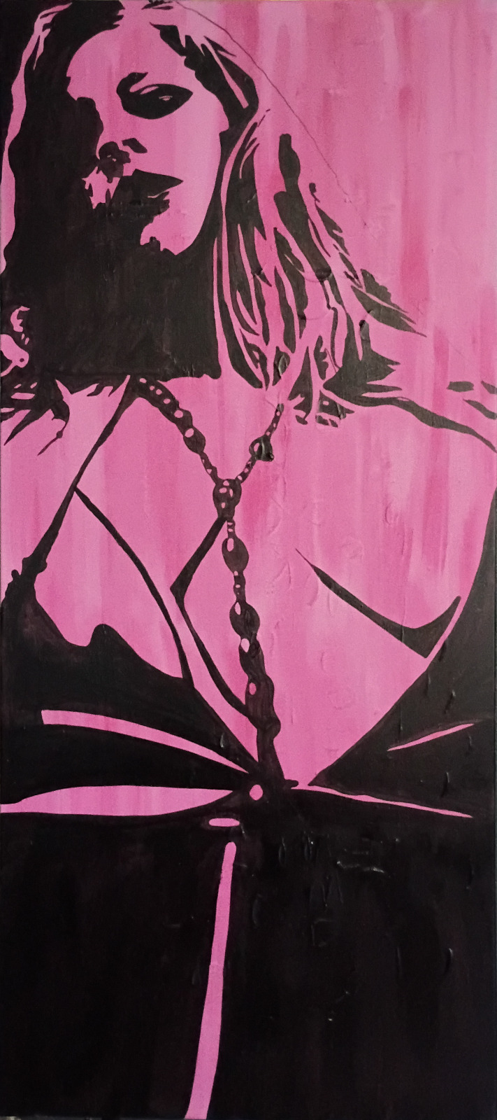 Tall black and pink portrait of a woman wearing necklaces and a strappy top