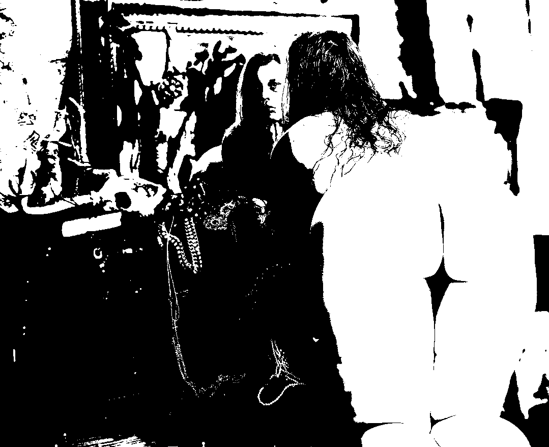 Black-and-white portrait of a figure facing a mirror, with her back and reflection visible together