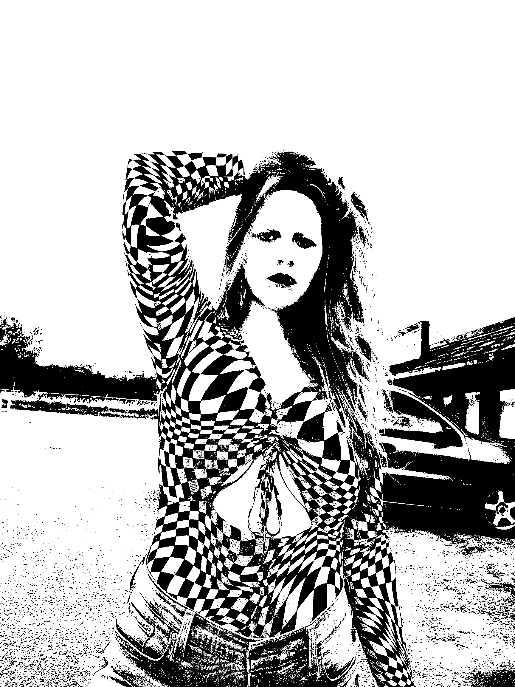 Black-and-white portrait in a checkered top outdoors