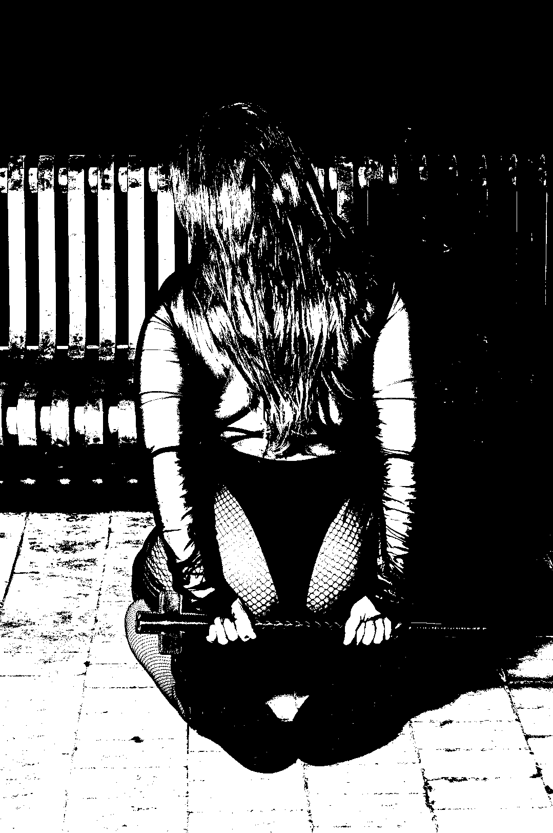 Kneeling figure with hair falling forward