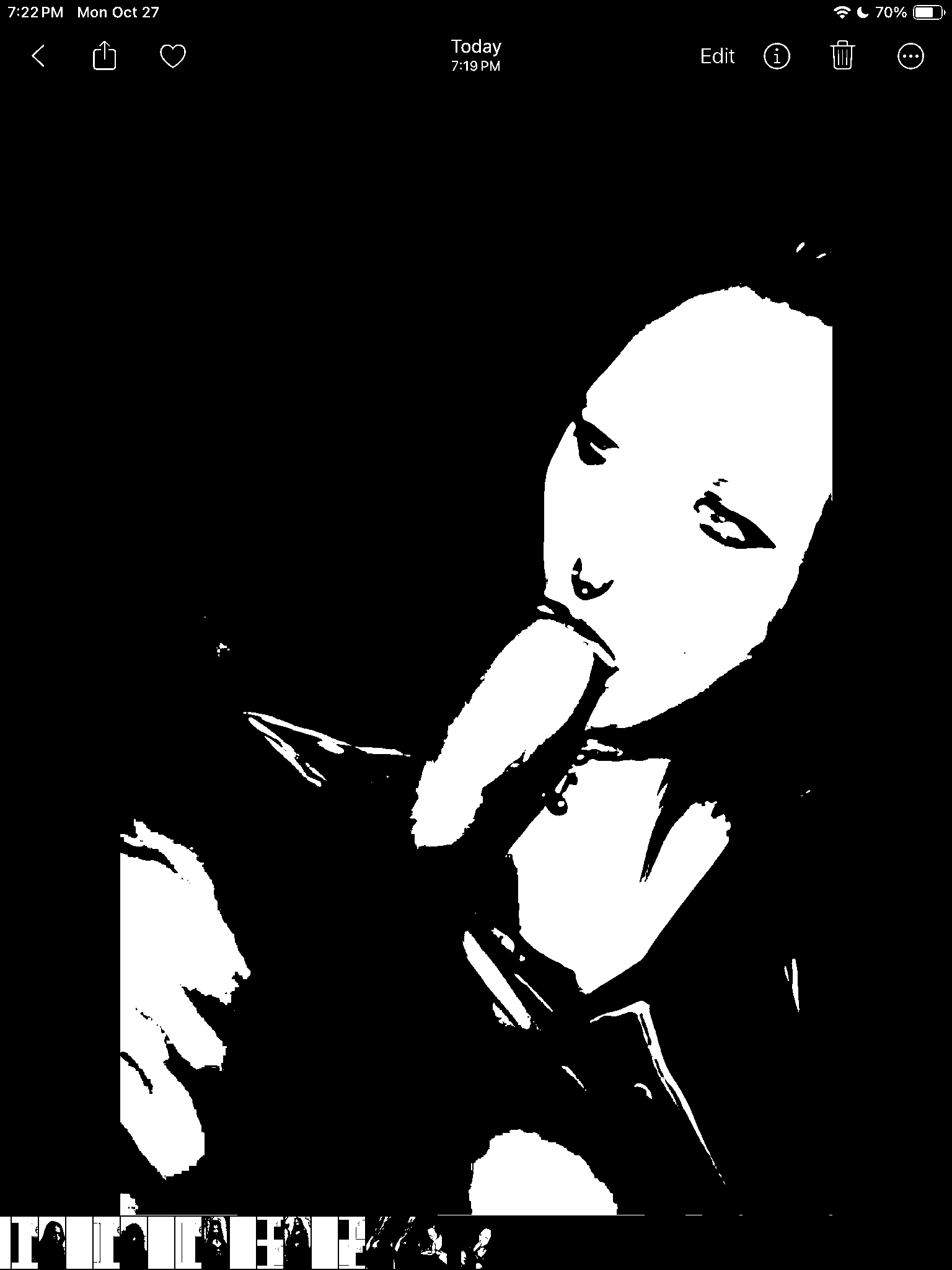 Dark threshold portrait with a playful expression