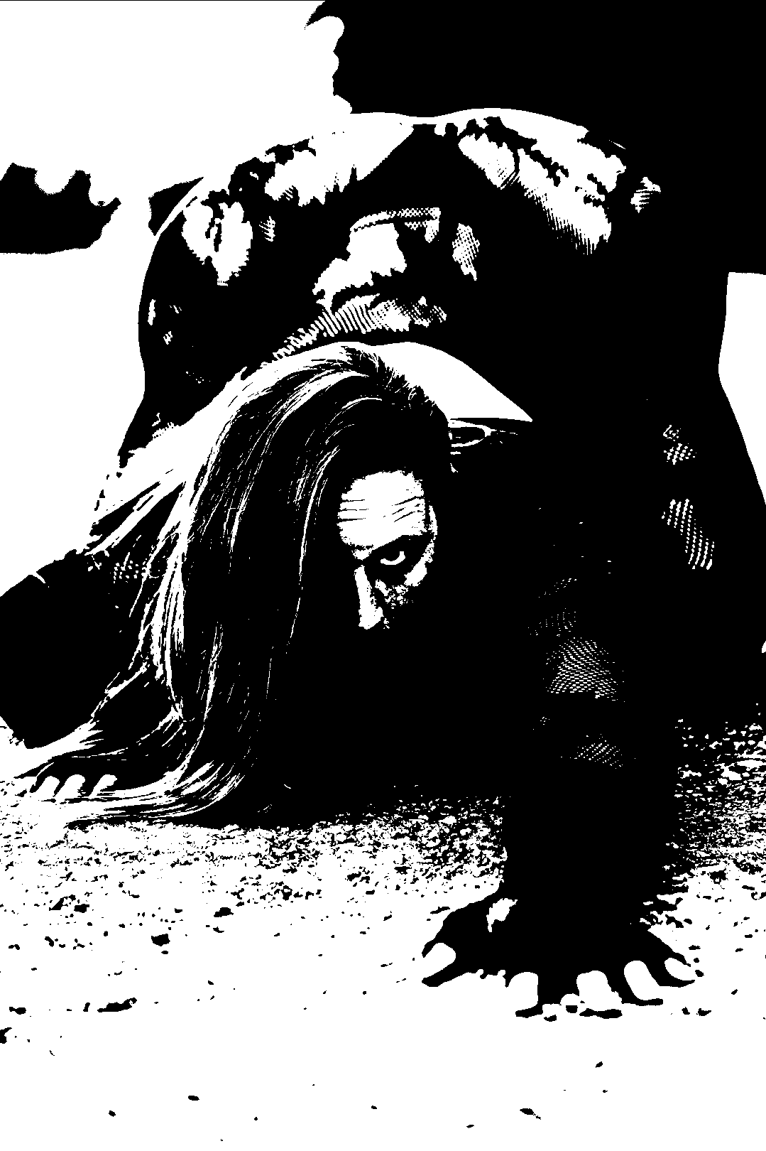 Figure low to the ground with hands extended and hair falling forward