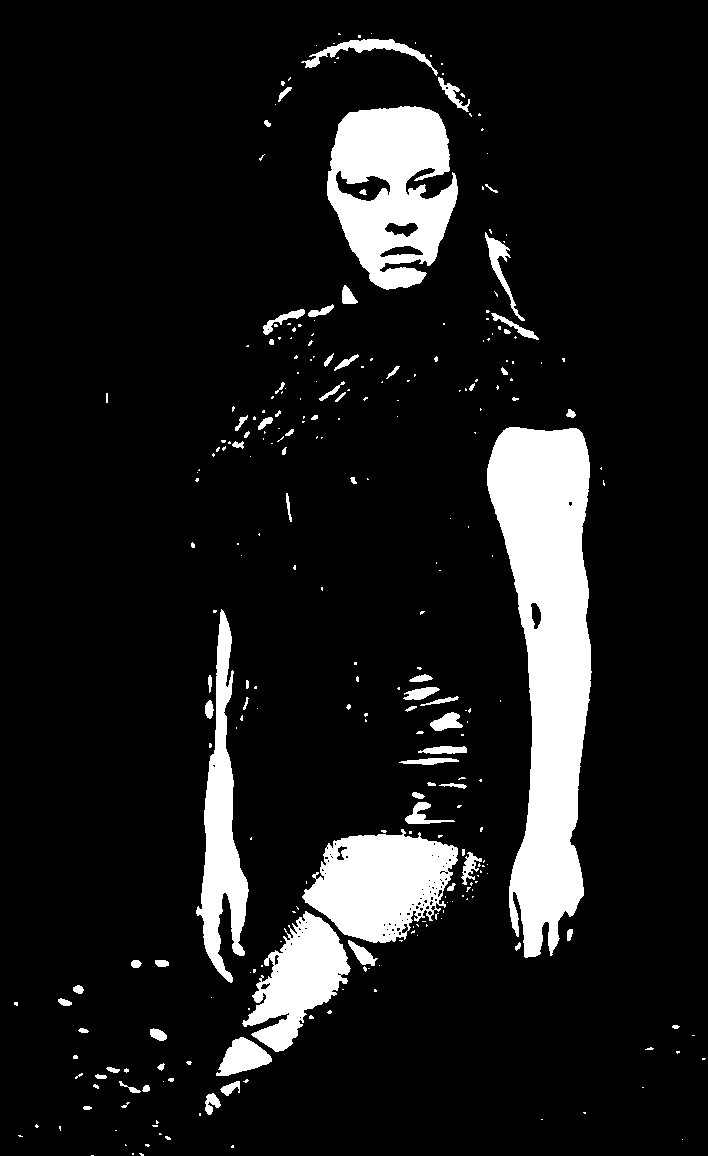 Standing figure against a deep black background