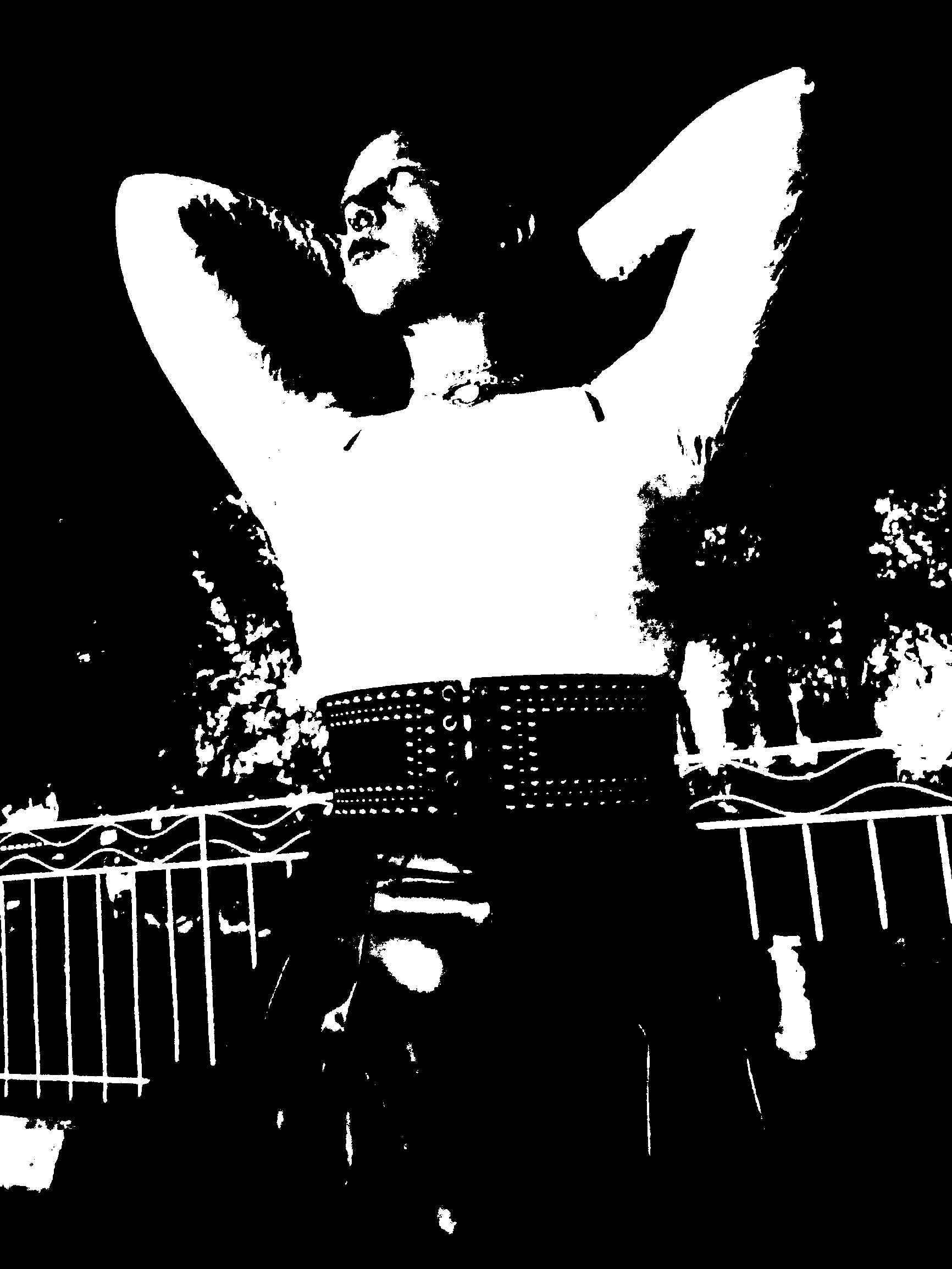 Threshold portrait with both arms lifted behind the head