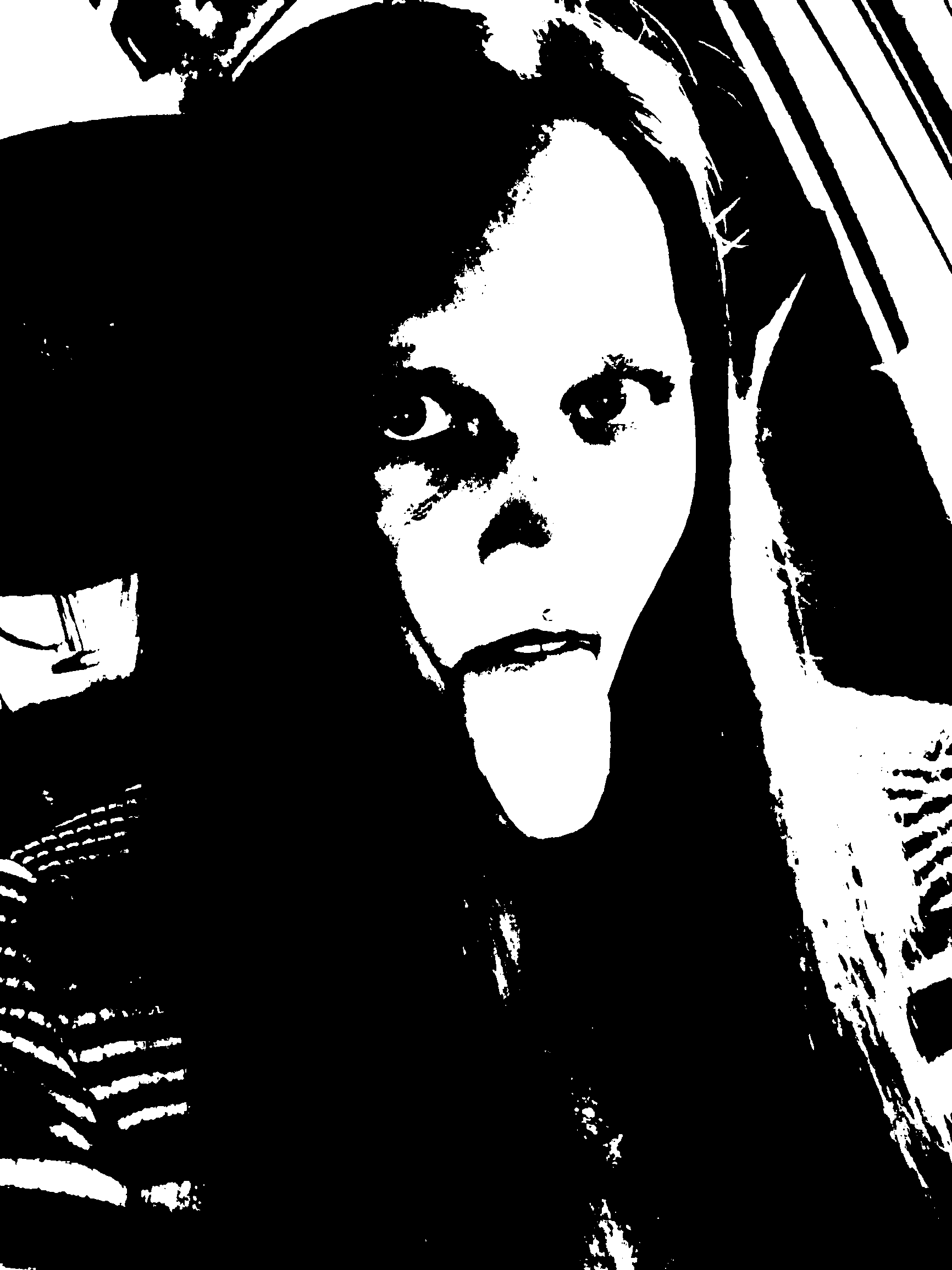 Playful black-and-white portrait with tongue extended