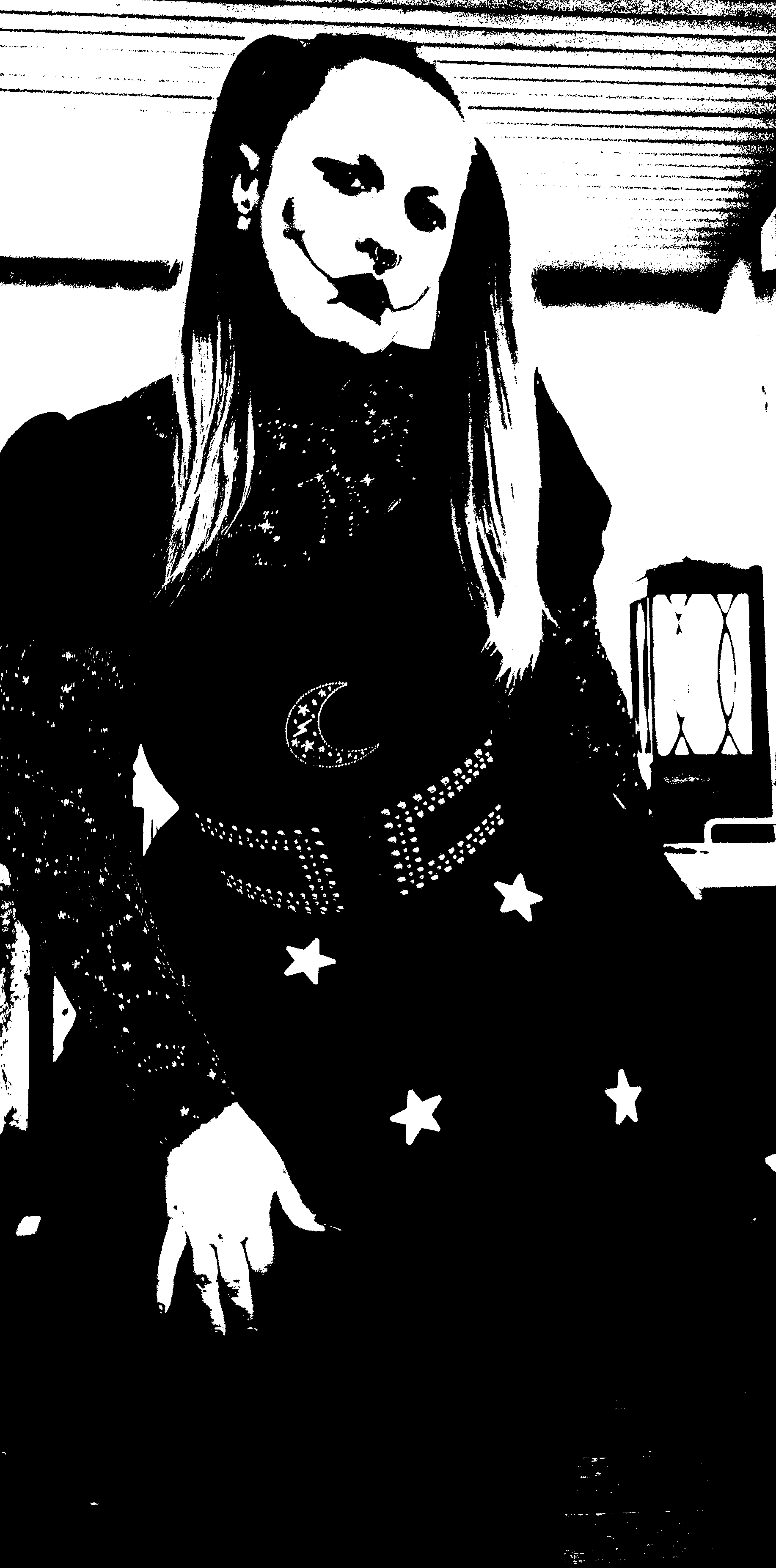 Standing threshold portrait in a star-patterned skirt